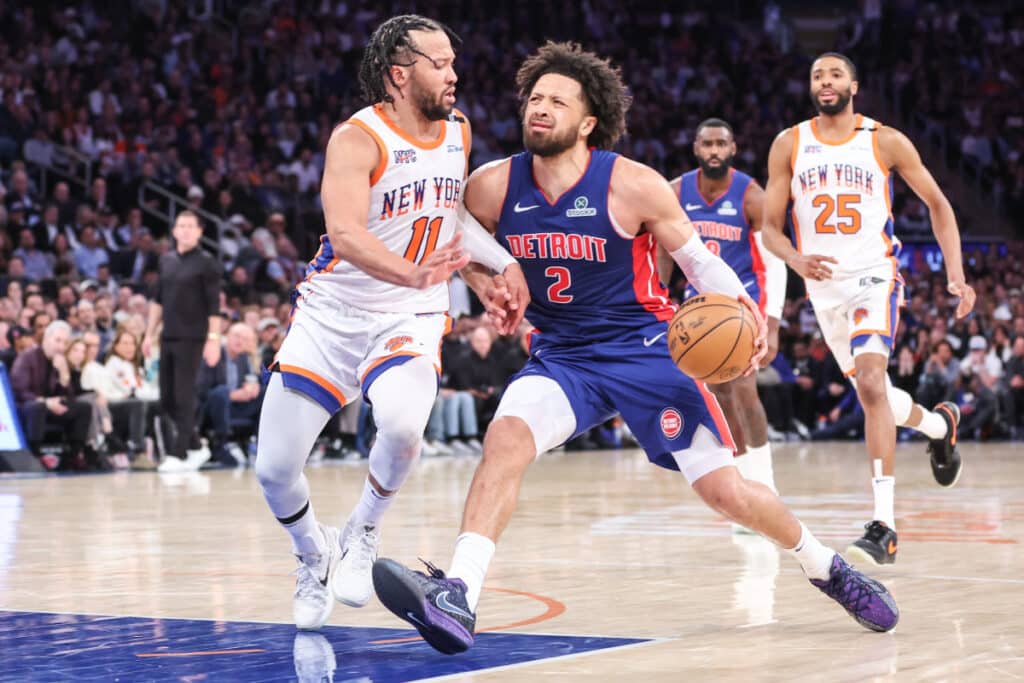 Detroit Pistons guard Cade Cunningham drives to the basket against New York Knicks guard Jalen Brunson during a tense playoff game at Little Caesars Arena.